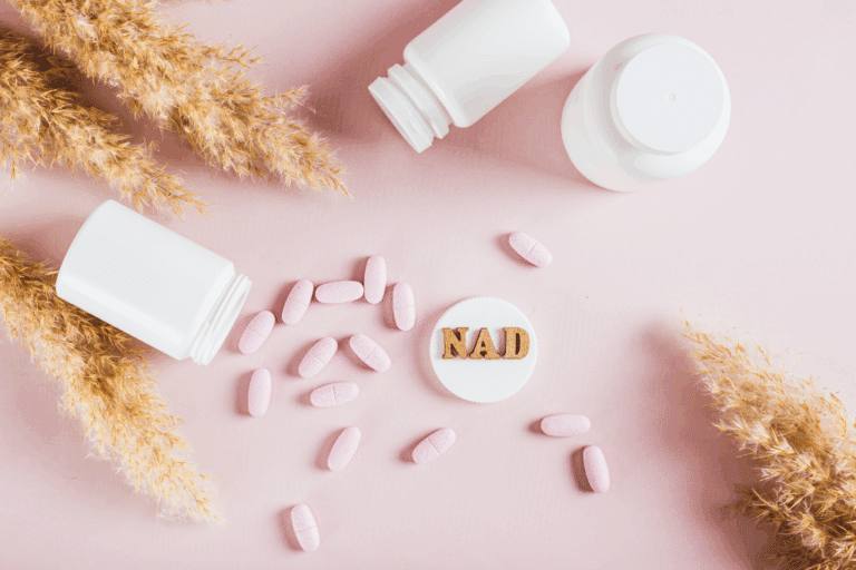 Nicotinamide adenine dinucleotide anti-aging pills and bottles on the table top view