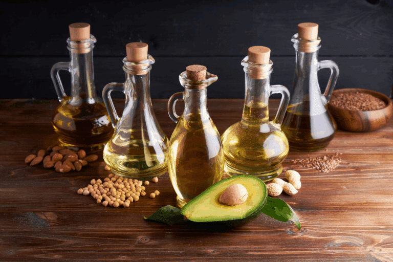 Healthy cooking oils including olive oil and seed oils with nuts seeds and avocado for heart health and nutrition