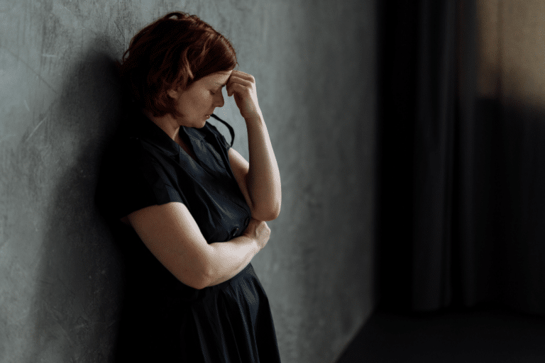 Woman struggling with antidepressant withdrawal symptoms after starting HRT